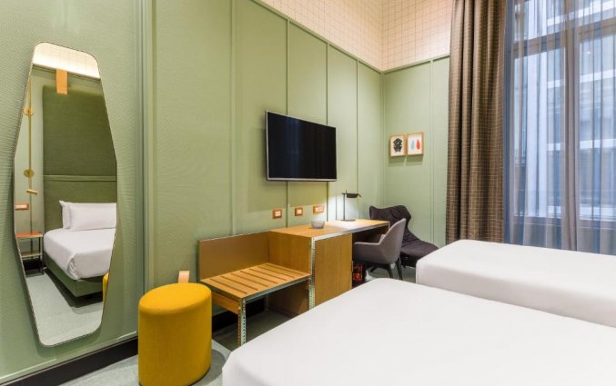 Slaapkamer van hotel Room Mate Giulia in Milaan